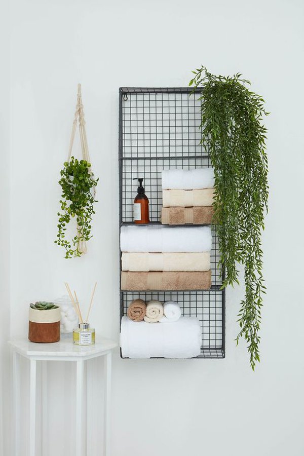Towel-storage-with-plants-decoration